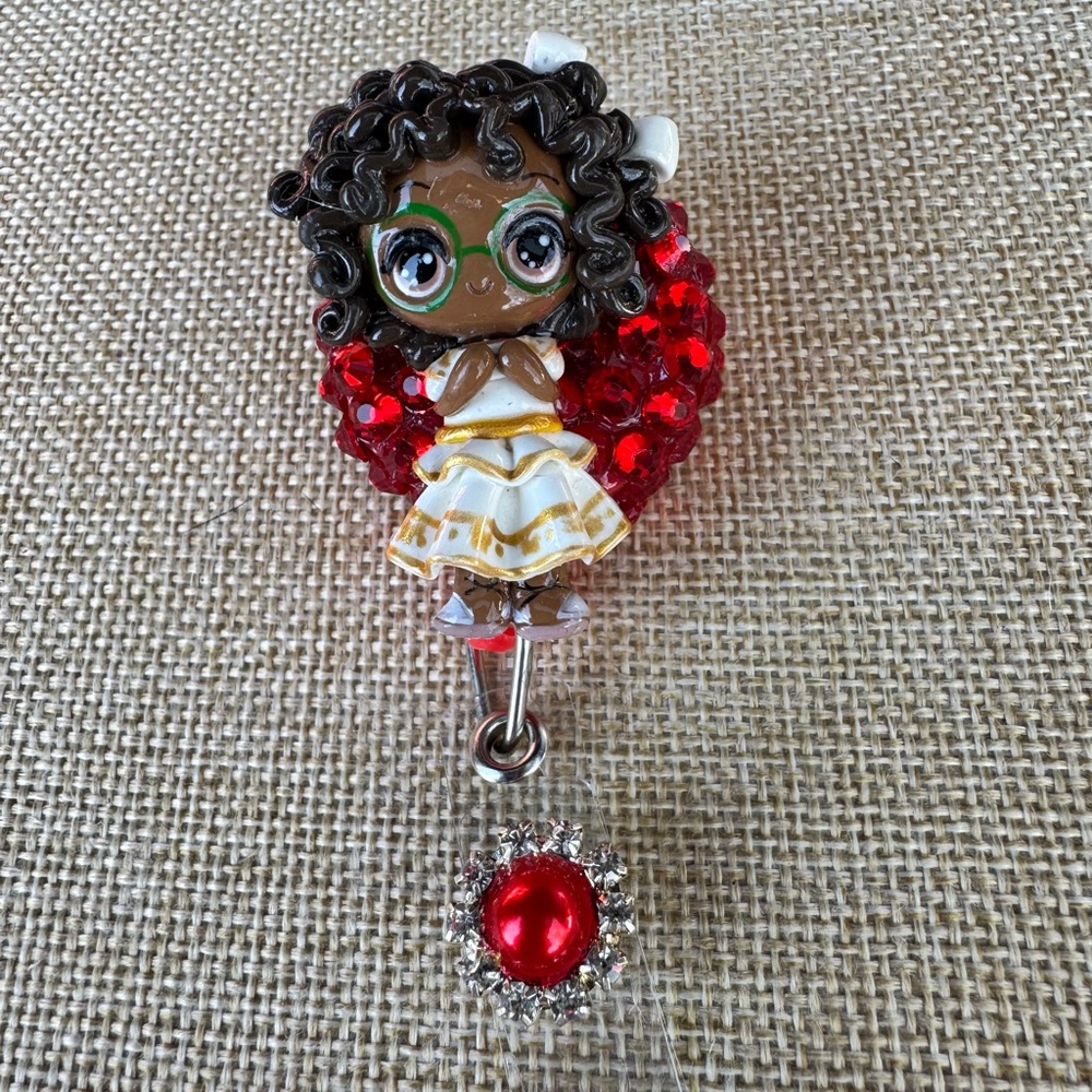 Decorative Girl Figurine Badge Reel with Red Crystal Accent